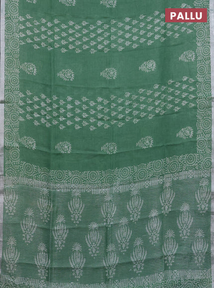 Pure linen saree green with allover butta prints and silver zari woven border