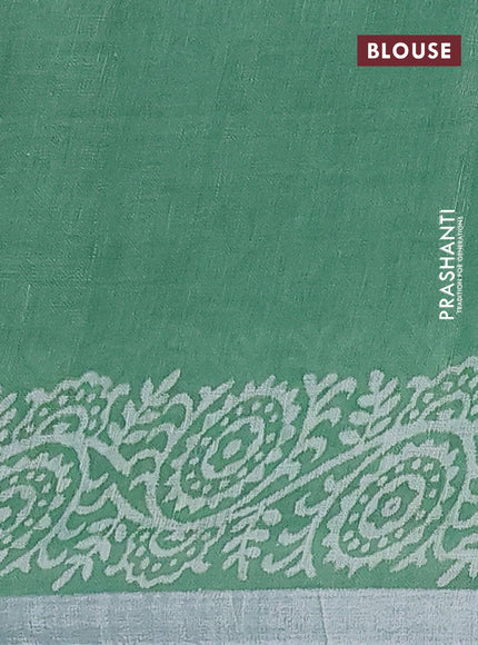 Pure linen saree green with allover butta prints and silver zari woven border