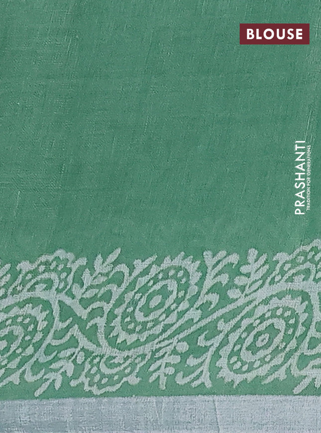 Pure linen saree green with allover butta prints and silver zari woven border