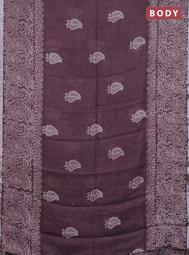 Pure linen saree mild wine shade with butta prints and silver zari woven border