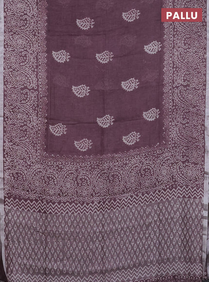 Pure linen saree mild wine shade with butta prints and silver zari woven border