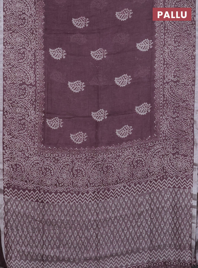 Pure linen saree mild wine shade with butta prints and silver zari woven border