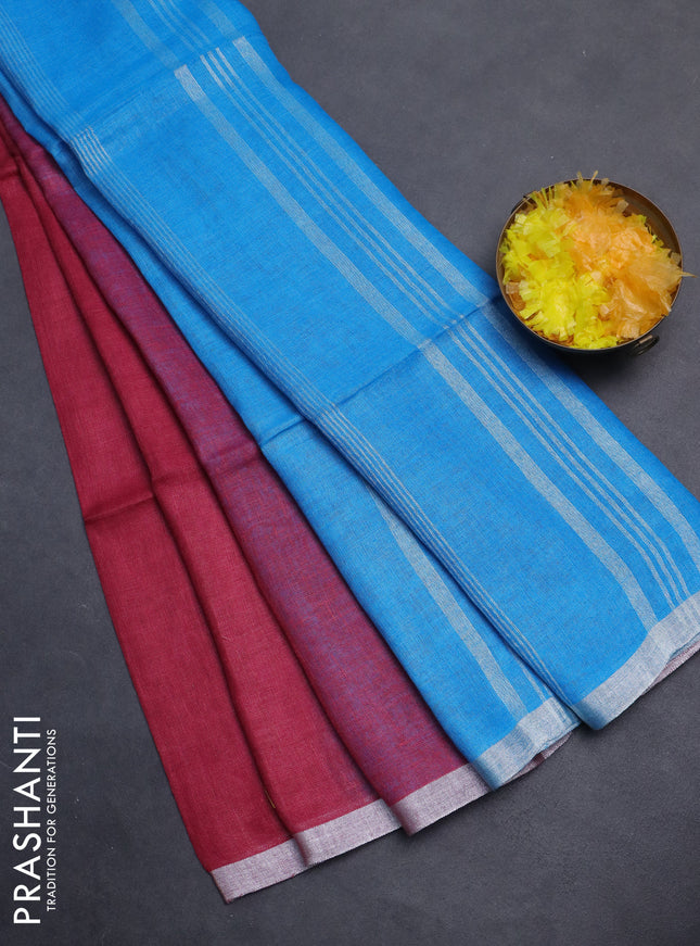 Pure linen saree dark pink and cs blue with plain body and silver zari woven border