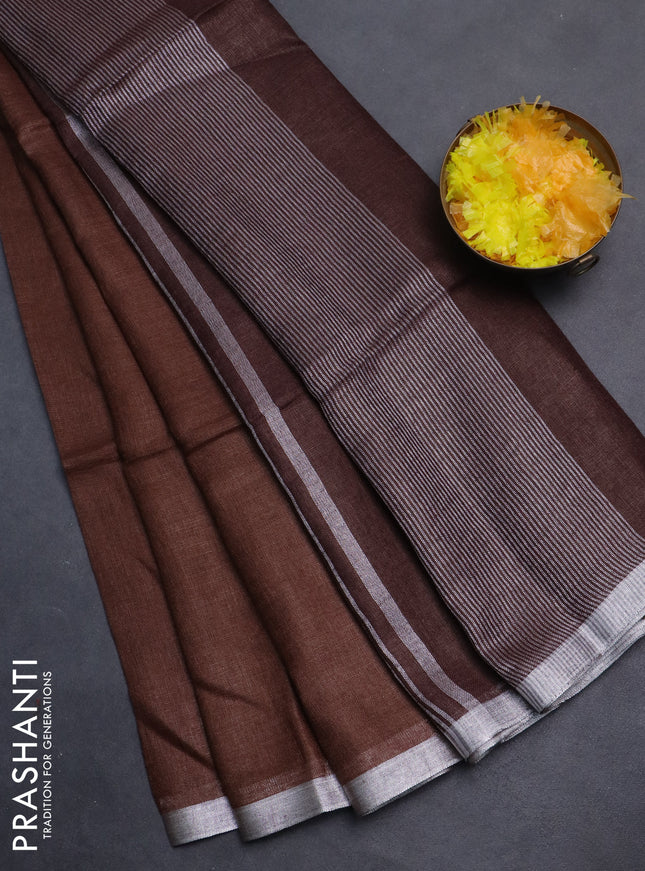 Pure linen saree brown with plain body and silver zari woven border