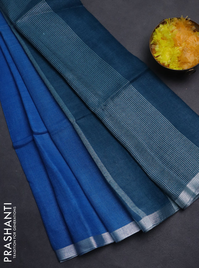 Pure linen saree cs blue and teal blue with plain body and silver zari woven border