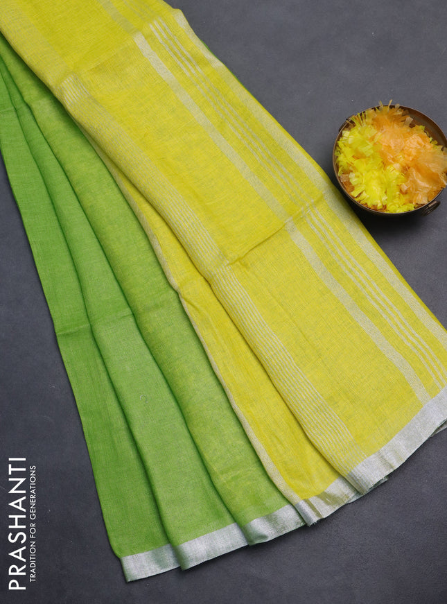 Pure linen saree light green and lime yellow with plain body and silver zari woven border