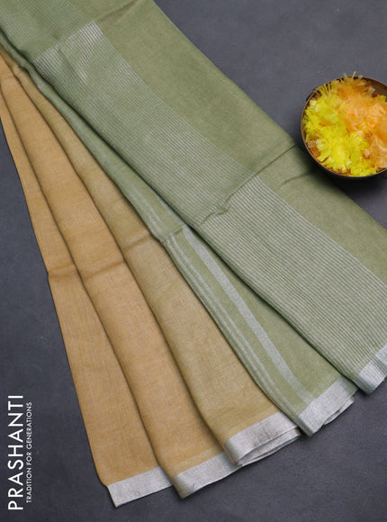 Pure linen saree sandal and pastel green with plain body and silver zari woven border