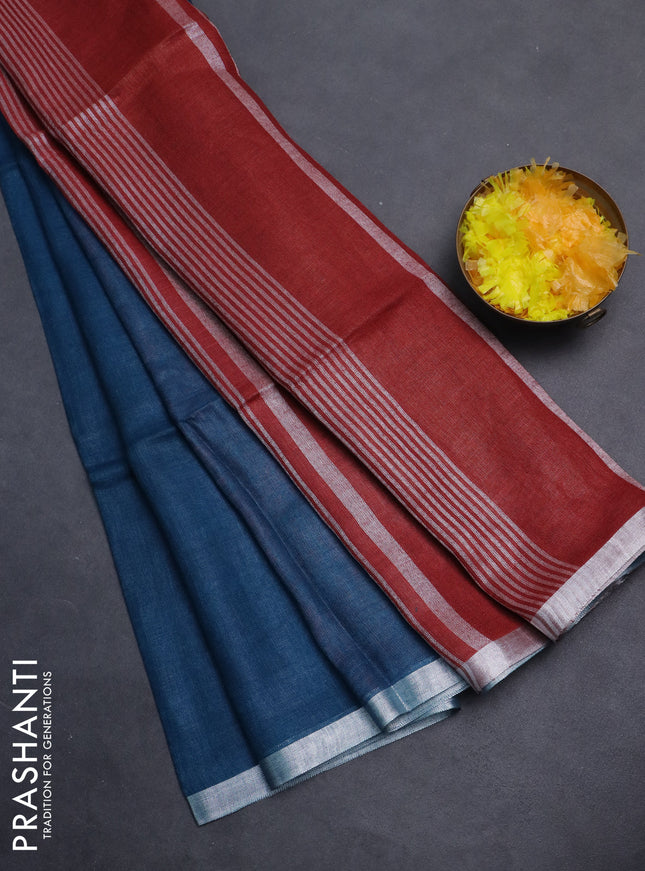 Pure linen saree peacock blue and maroon with plain body and silver zari woven border