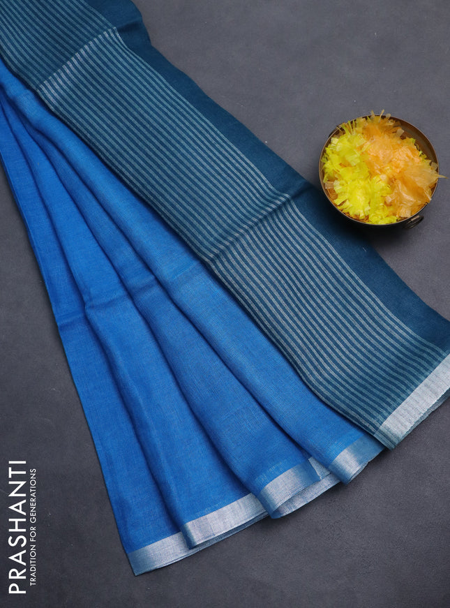 Pure linen saree cs blue and teal blue with plain body and silver zari woven border