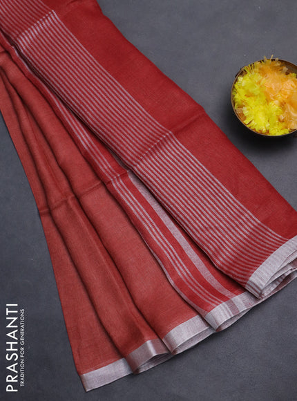 Pure linen saree rust shade and maroon with plain body and silver zari woven border
