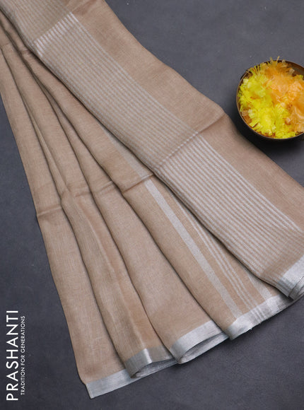 Pure linen saree beige with plain body and silver zari woven border