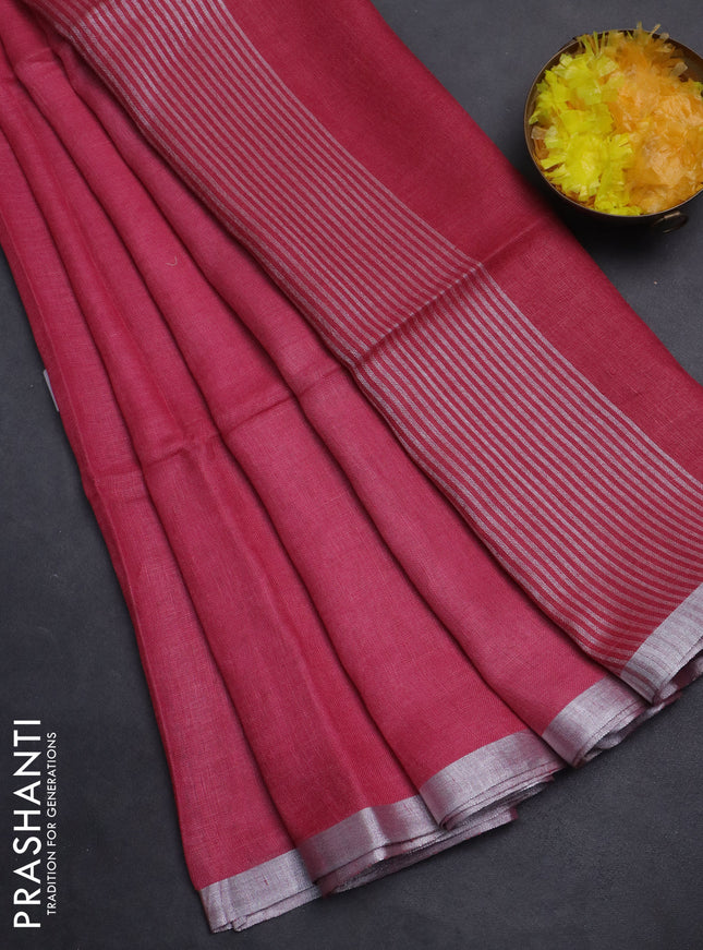 Pure linen saree pink shade with plain body and silver zari woven border