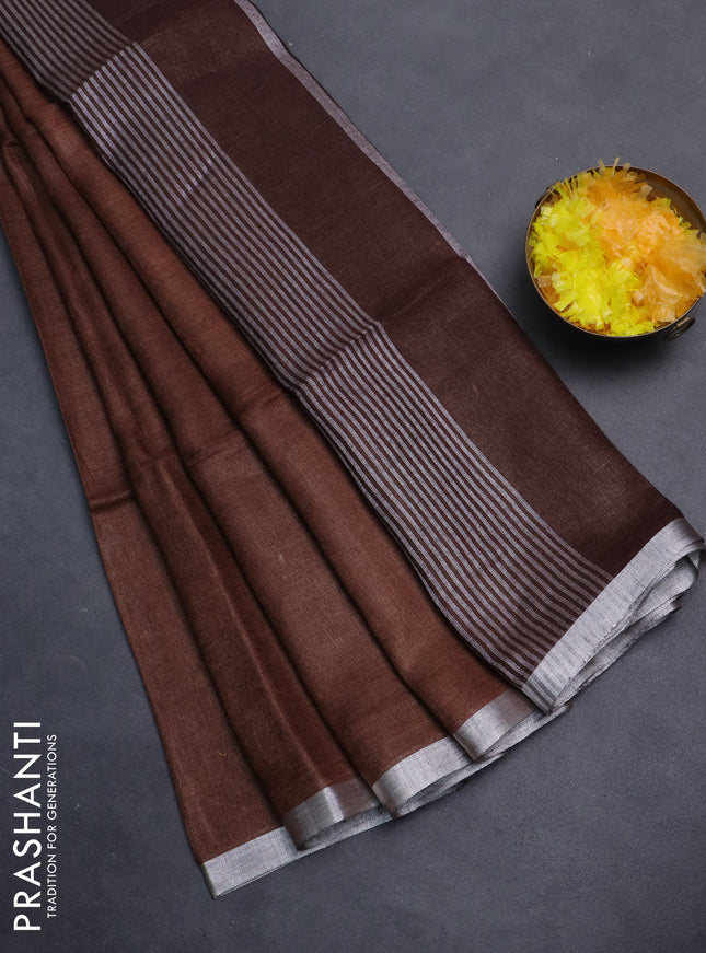 Pure linen saree brown with plain body and silver zari woven border
