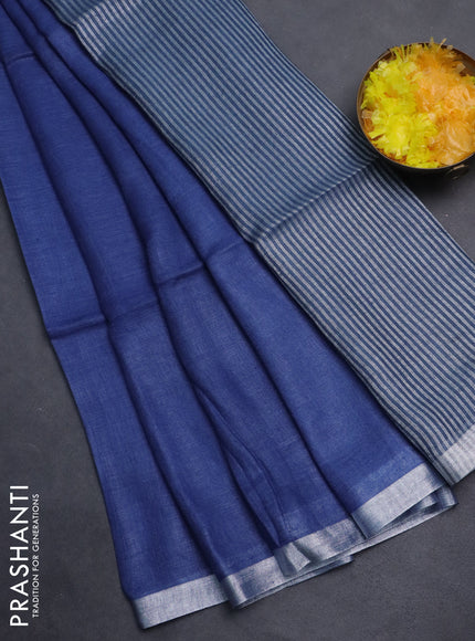 Pure linen saree blue shade and bluish grey with plain body and silver zari woven border
