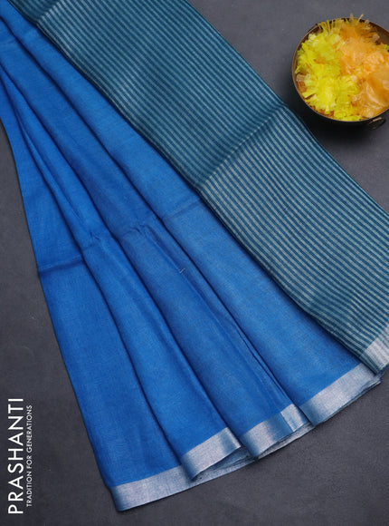 Pure linen saree cs blue and peacock blue with plain body and silver zari woven border