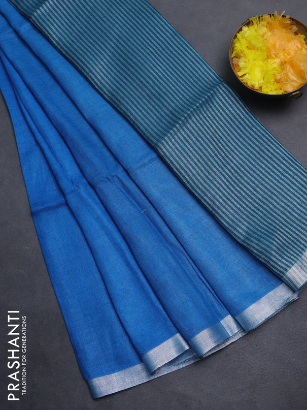 Pure linen saree cs blue and peacock blue with plain body and silver zari woven border