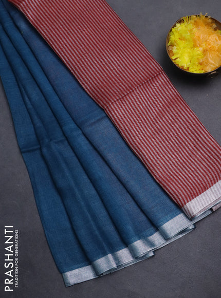 Pure linen saree peacock blue and maroon with plain body and silver zari woven border