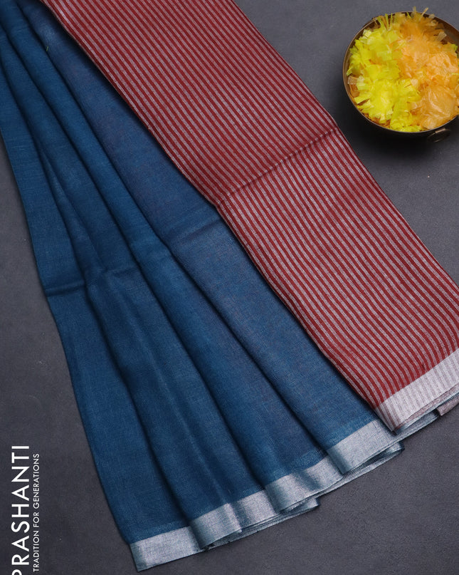 Pure linen saree peacock blue and maroon with plain body and silver zari woven border