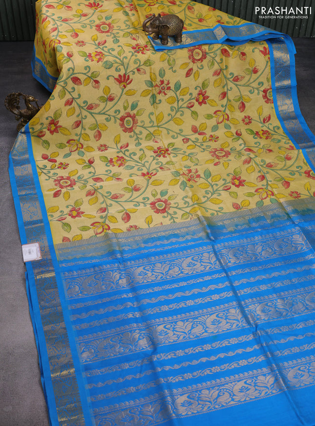 Silk cotton saree pale yellow and cs blue with allover kalamkari prints and zari woven korvai border
