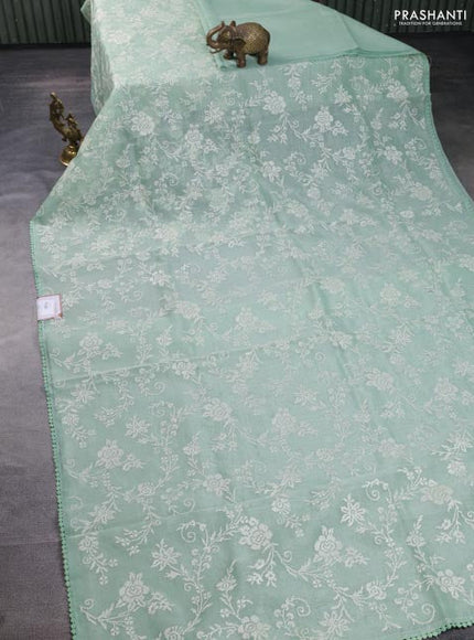 Chanderi tissue saree pastel green with allover embroidery and lace work border