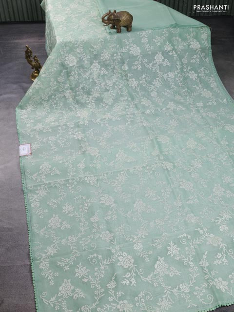Chanderi tissue saree pastel green with allover embroidery and lace work border
