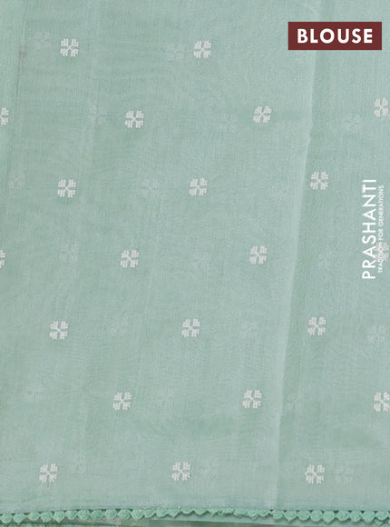 Chanderi tissue saree pastel green with allover embroidery and lace work border
