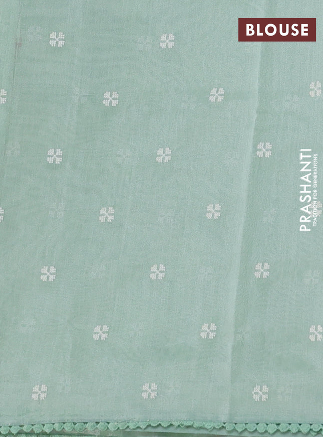 Chanderi tissue saree pastel green with allover embroidery and lace work border