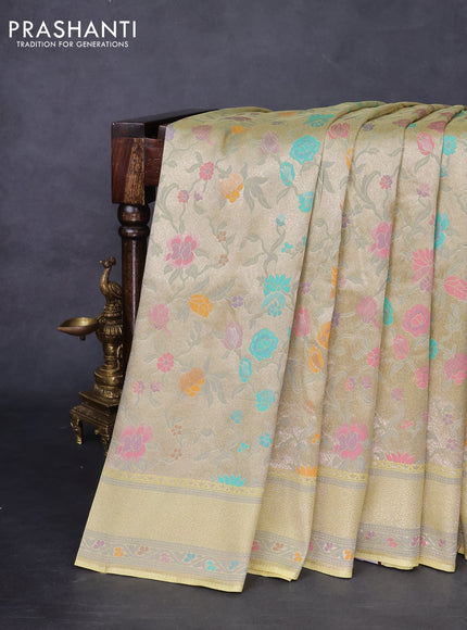 Banarasi tissue silk saree pale yellow with allover thread woven floral weaves and silver zari woven border