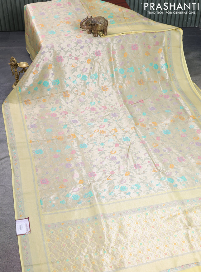 Banarasi tissue silk saree pale yellow with allover thread woven floral weaves and silver zari woven border