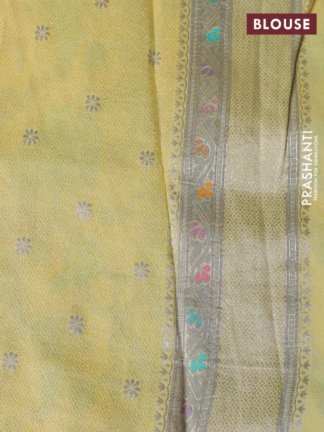Banarasi tissue silk saree pale yellow with allover thread woven floral weaves and silver zari woven border