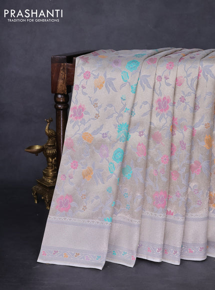 Banarasi tissue silk saree off white with allover thread woven floral weaves and silver zari woven border