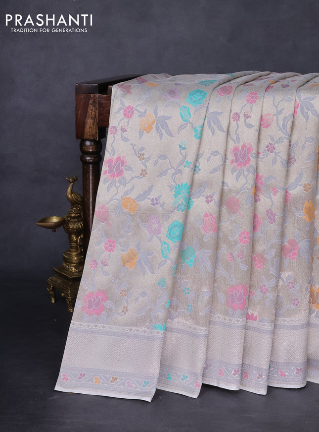 Banarasi tissue silk saree off white with allover thread woven floral weaves and silver zari woven border