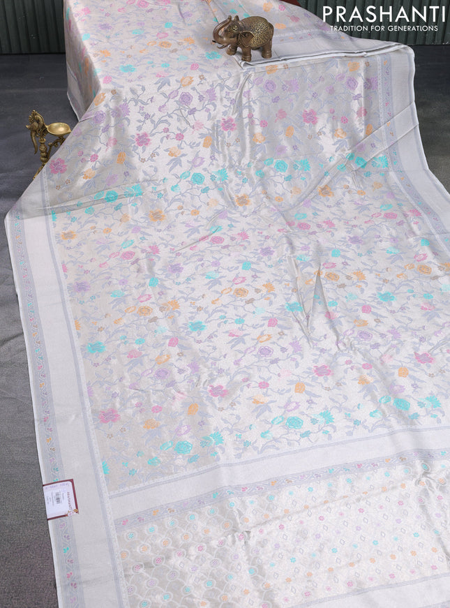 Banarasi tissue silk saree off white with allover thread woven floral weaves and silver zari woven border