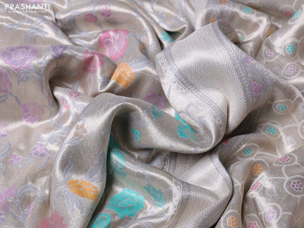 Banarasi tissue silk saree off white with allover thread woven floral weaves and silver zari woven border