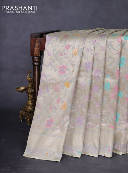 Banarasi tissue silk saree mild pista green with allover thread woven floral weaves and silver zari woven border