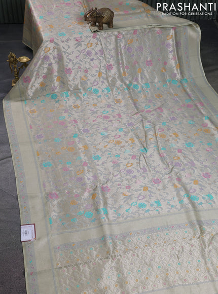 Banarasi tissue silk saree mild pista green with allover thread woven floral weaves and silver zari woven border