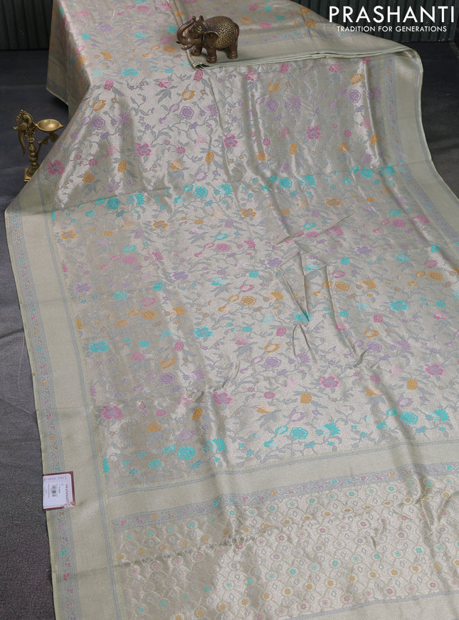Banarasi tissue silk saree mild pista green with allover thread woven floral weaves and silver zari woven border