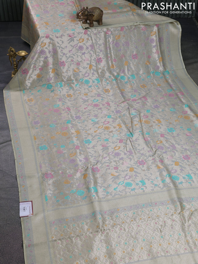 Banarasi tissue silk saree mild pista green with allover thread woven floral weaves and silver zari woven border