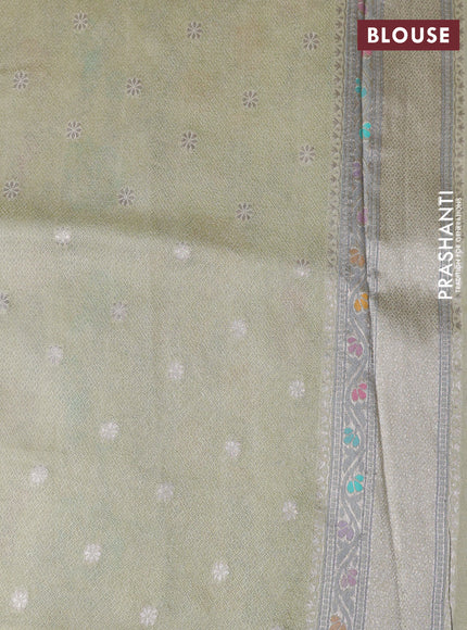 Banarasi tissue silk saree mild pista green with allover thread woven floral weaves and silver zari woven border