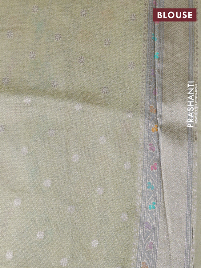 Banarasi tissue silk saree mild pista green with allover thread woven floral weaves and silver zari woven border