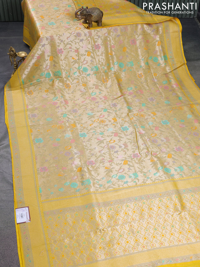 Banarasi tissue silk saree yellow with allover thread woven floral weaves and silver zari woven border
