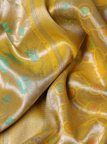 Banarasi tissue silk saree yellow with allover thread woven floral weaves and silver zari woven border