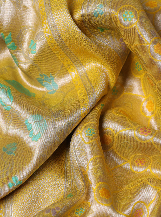 Banarasi tissue silk saree yellow with allover thread woven floral weaves and silver zari woven border