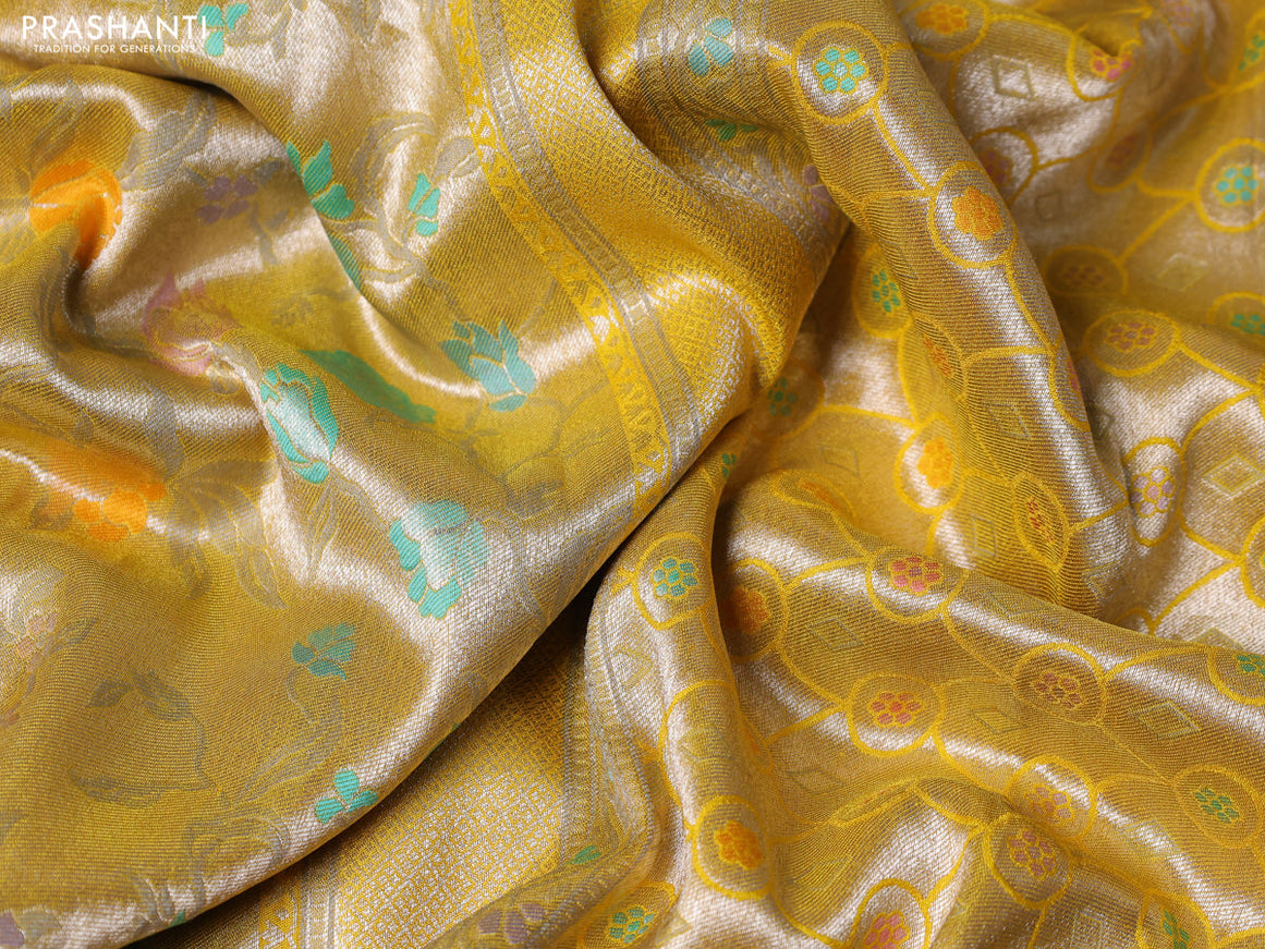 Banarasi tissue silk saree yellow with allover thread woven floral weaves and silver zari woven border