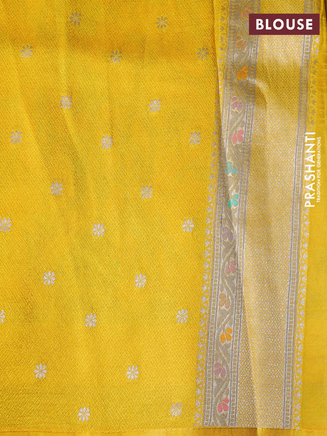 Banarasi tissue silk saree yellow with allover thread woven floral weaves and silver zari woven border
