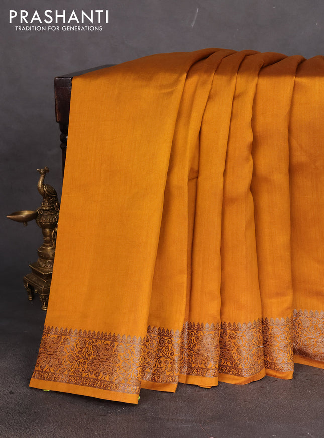 Chiniya silk saree dark mustard with plain body and woven border