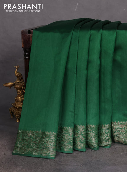 Chiniya silk saree green with plain body and woven border