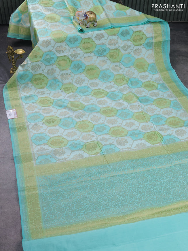 Chiniya silk saree teal blue shade and light green with allover zari weaves and zari woven border