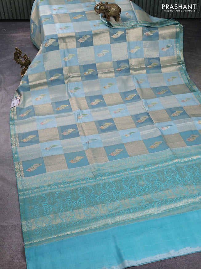 Chiniya silk saree greyish blue and teal blue with allover zari weaves and small zari woven border