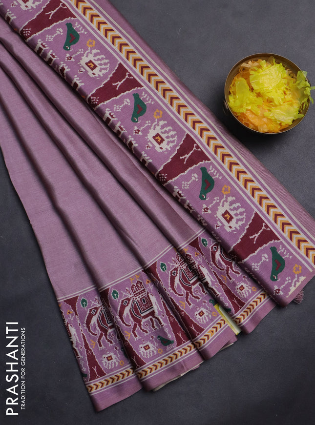 Semi tussar saree mild purple with plain body and patola printed border